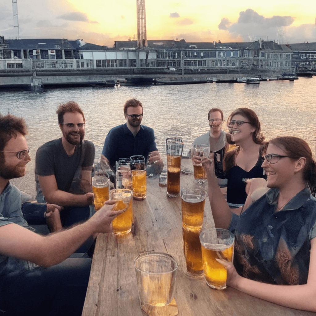 Six enlightened designers and developers sharing post-conference drinks on the Bristol harbour